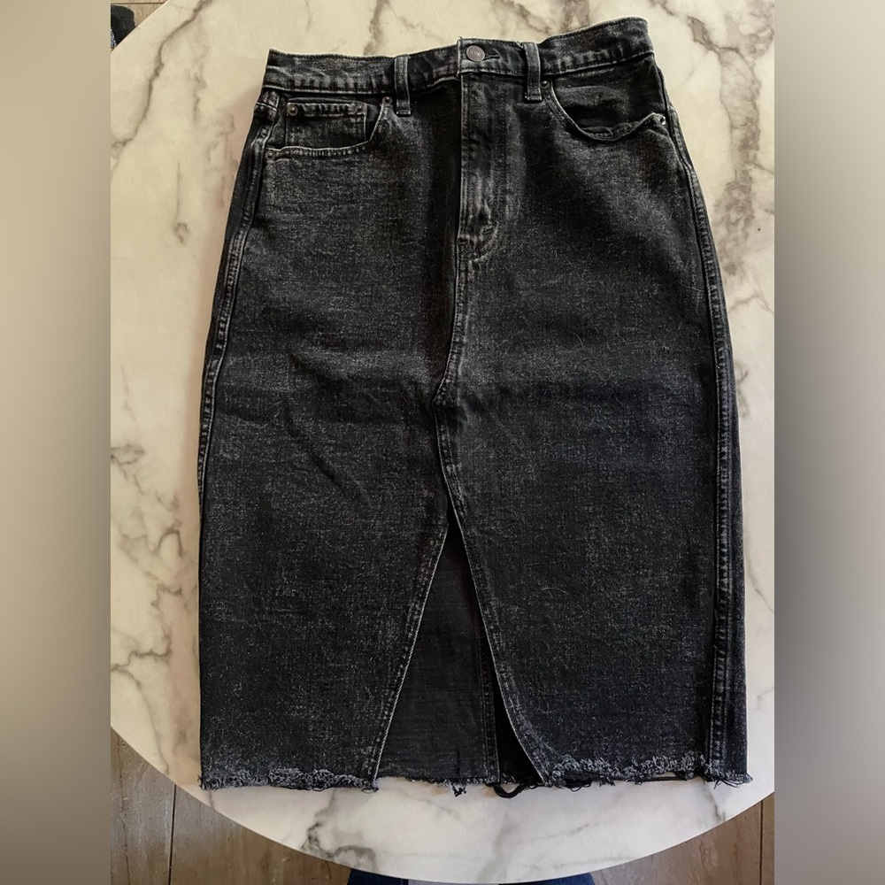Black Jean wash  pencil skirt S-28/6 . Like new. wore once . Slit in front